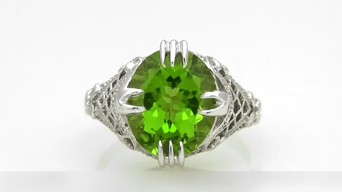 Art Deco Filigree 55 Carat Large Oval Peridot Statement Ring in 14 Karat White Gold Antique Jewelry Mall Rings